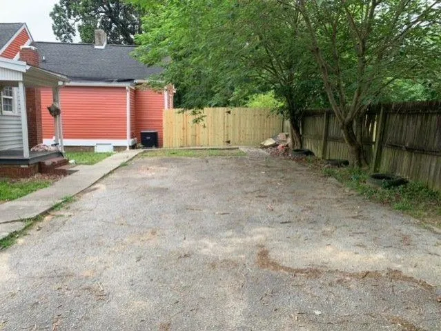 a view of a house with a yard and garage