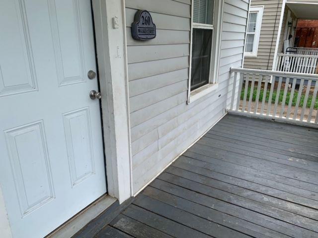 258 Walker Street Augusta, GA 30901 - Photo 5 of 16 a view of a balcony with wooden floor and staircase