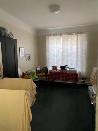 a bed room with a bed furniture and a window