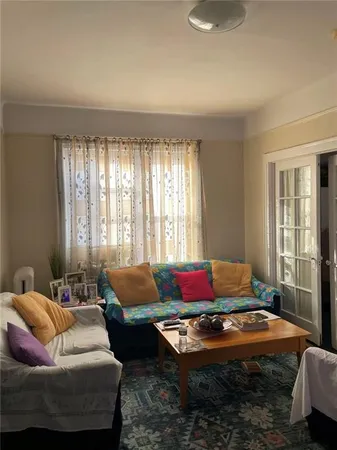 a living room with furniture and windows