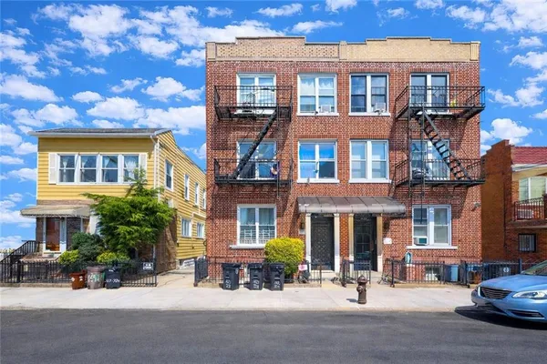 a building with a table and chairs in front of it