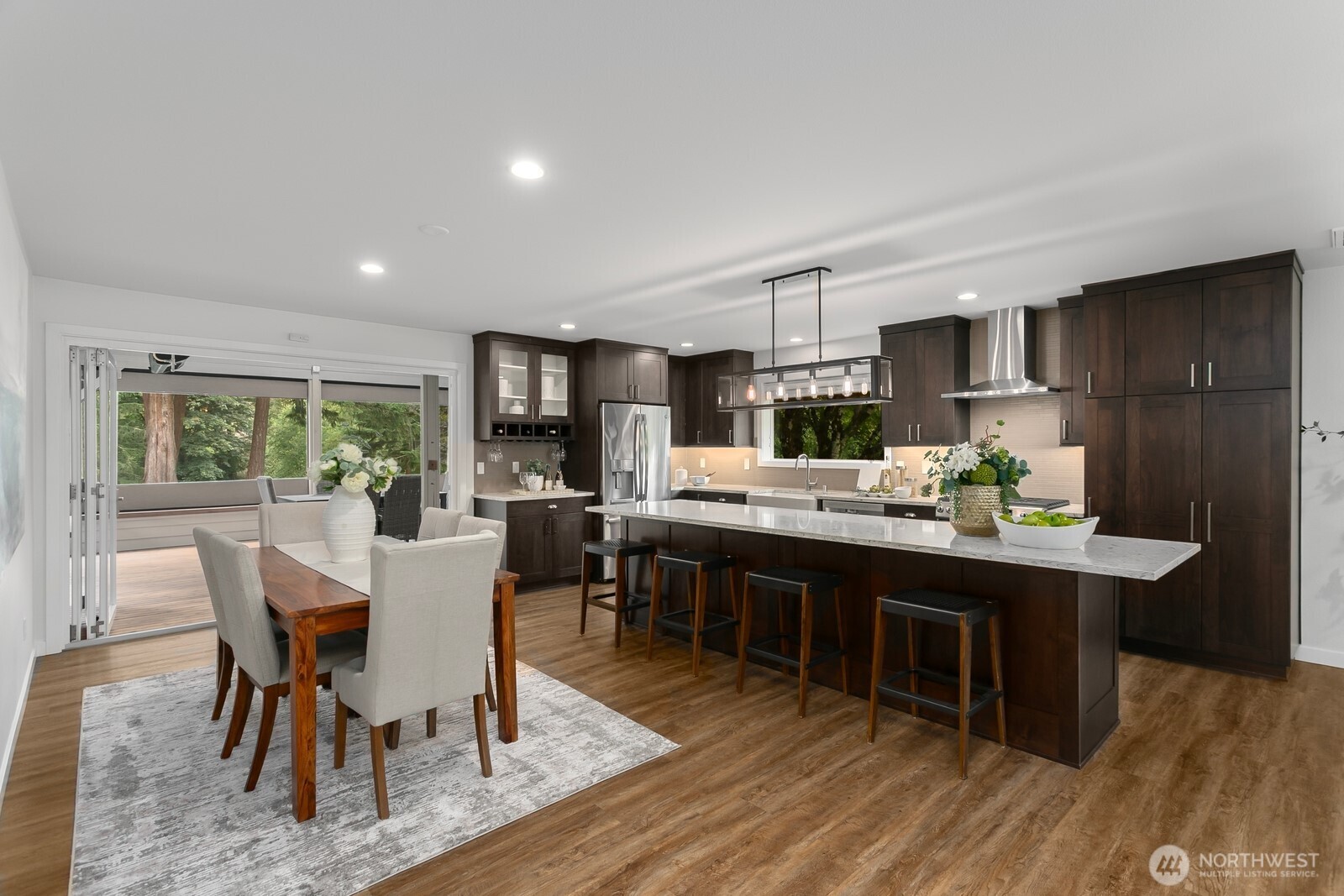 24020 Southeast 202nd Street Maple Valley, WA 98038 - Photo 11 of 39 a view of a dining room with furniture window and wooden floor