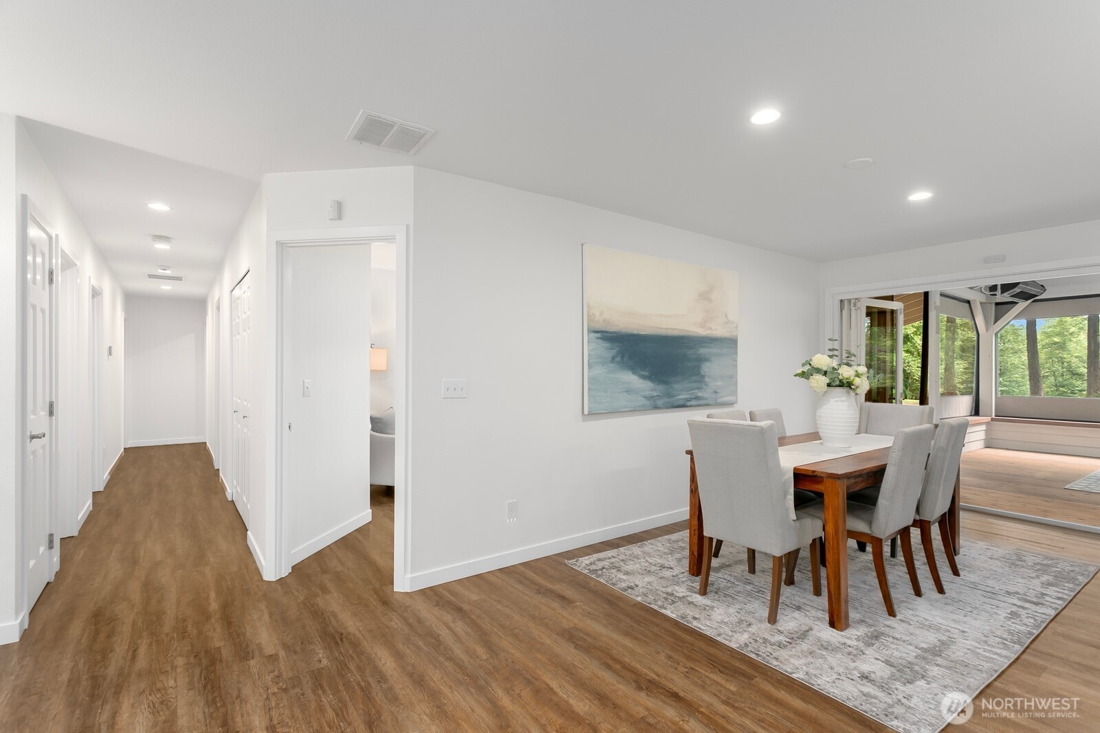 24020 Southeast 202nd Street Maple Valley, WA 98038 - Photo 12 of 39 a view of a dining room with furniture and wooden floor