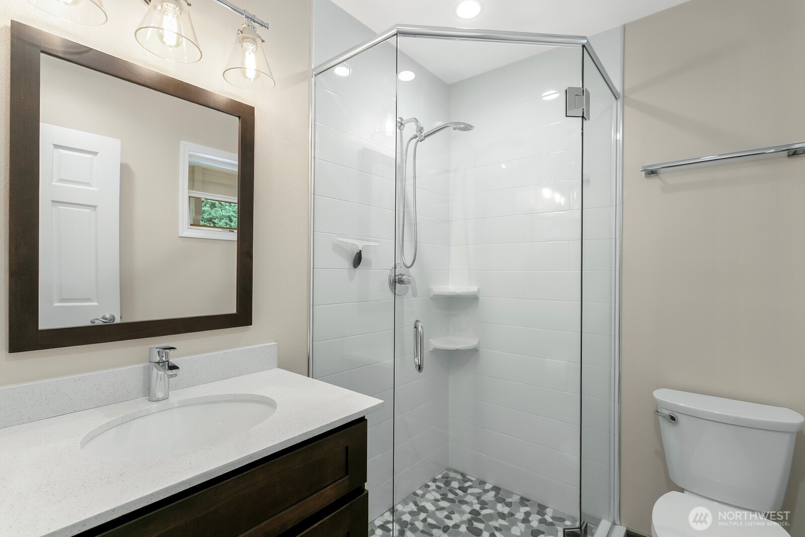 24020 Southeast 202nd Street Maple Valley, WA 98038 - Photo 21 of 39 a bathroom with a sink toilet vanity and shower