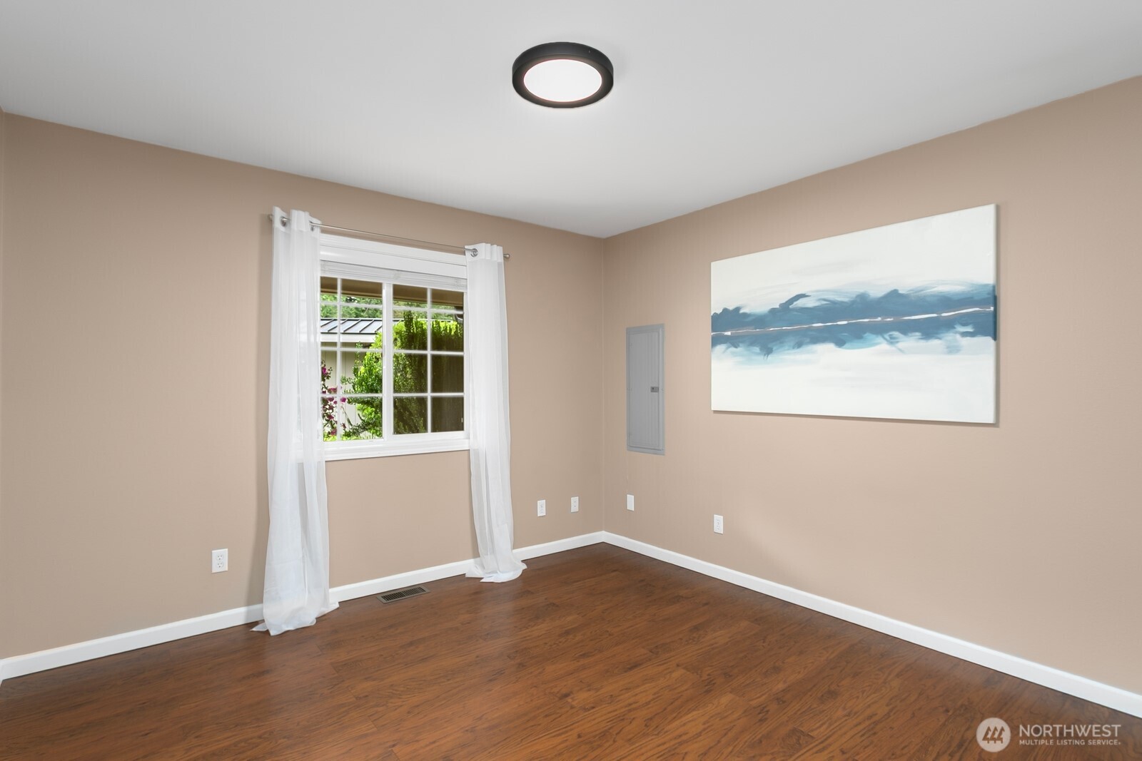 24020 Southeast 202nd Street Maple Valley, WA 98038 - Photo 22 of 39 an empty room with wooden floor and windows