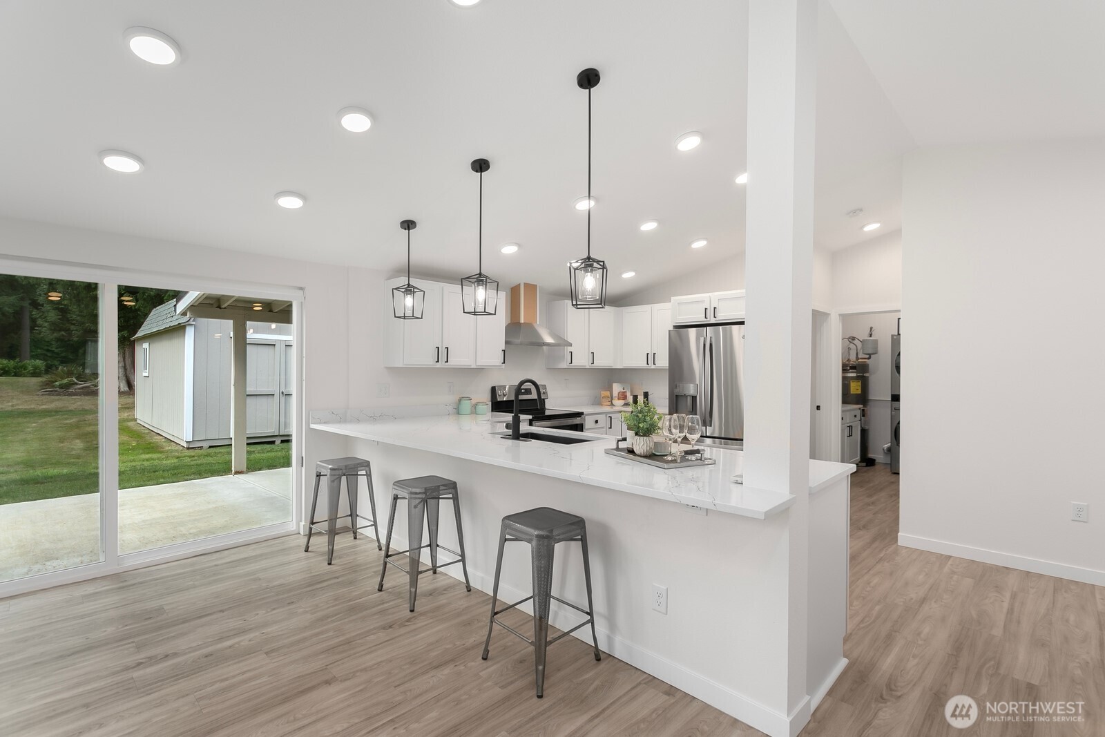 24020 Southeast 202nd Street Maple Valley, WA 98038 - Photo 26 of 39 a large kitchen with a table and chairs