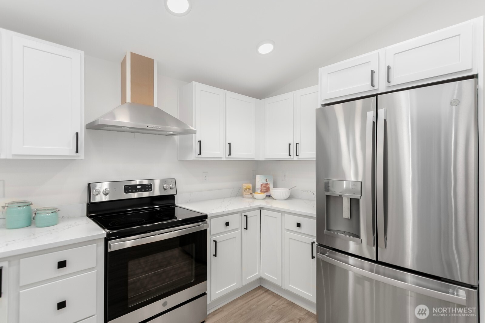 24020 Southeast 202nd Street Maple Valley, WA 98038 - Photo 28 of 39 a kitchen with stainless steel appliances a refrigerator sink and cabinets