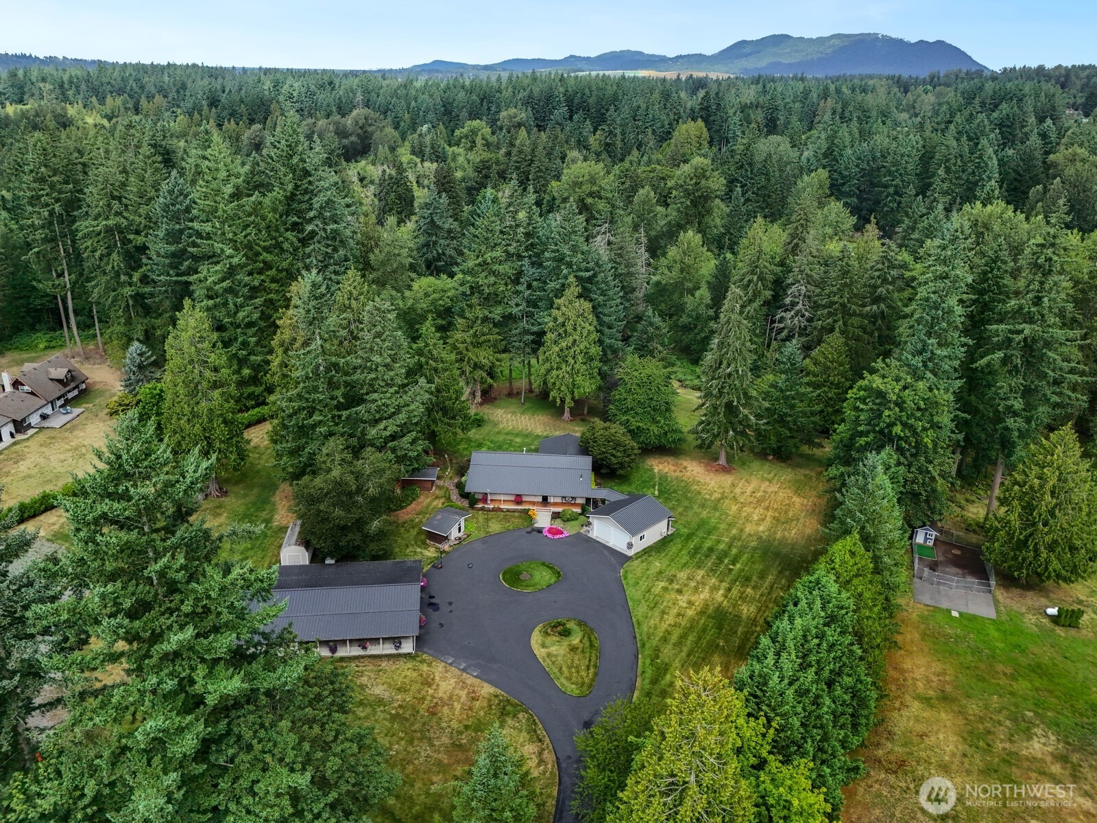 24020 Southeast 202nd Street Maple Valley, WA 98038 - Photo 3 of 39 an aerial view of a house with yard