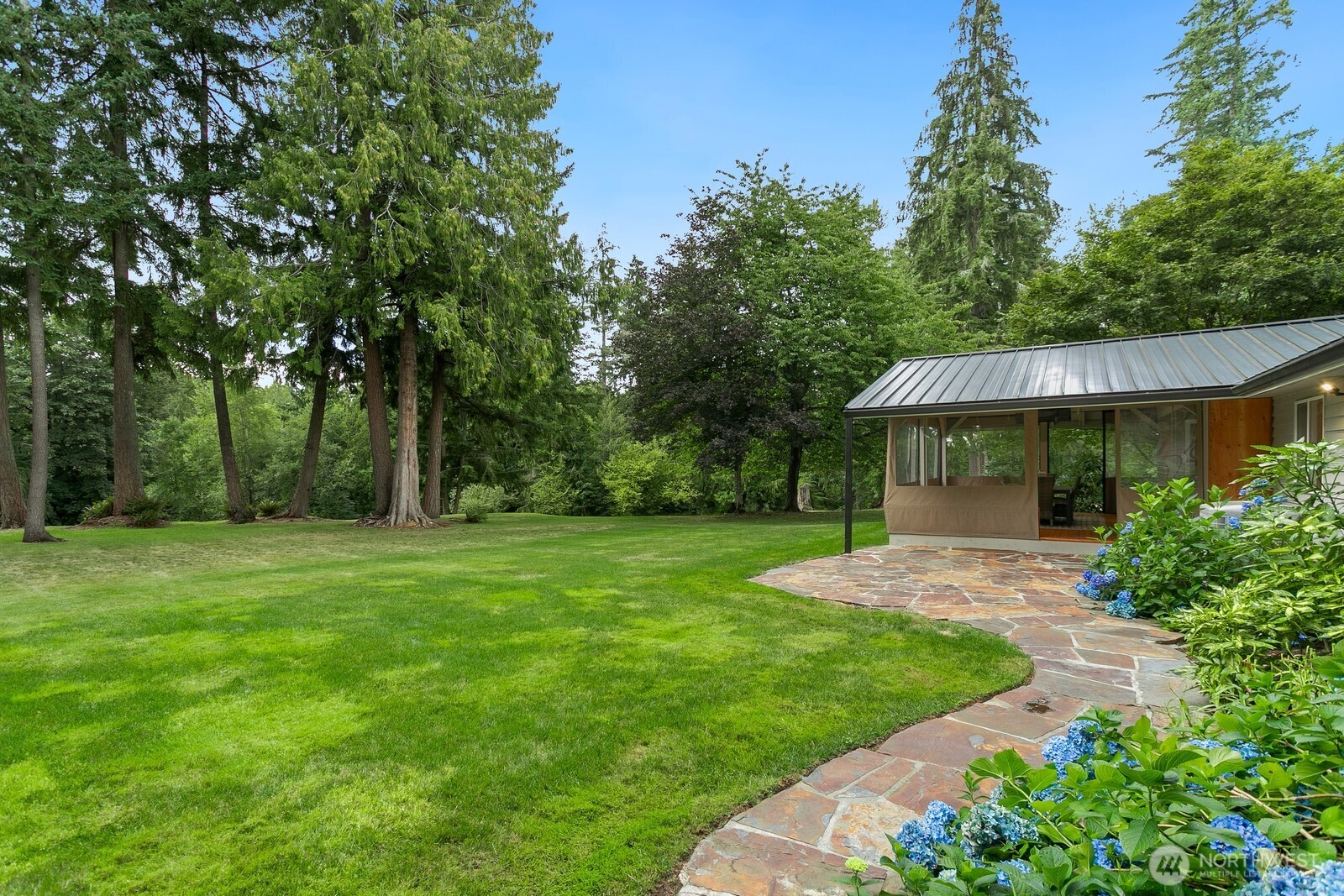 24020 Southeast 202nd Street Maple Valley, WA 98038 - Photo 37 of 39 a front view of a house with garden