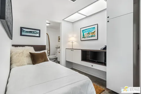 a bathroom with a toilet a sink and a mirror