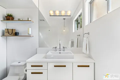 a view of swimming pool with a patio and garden