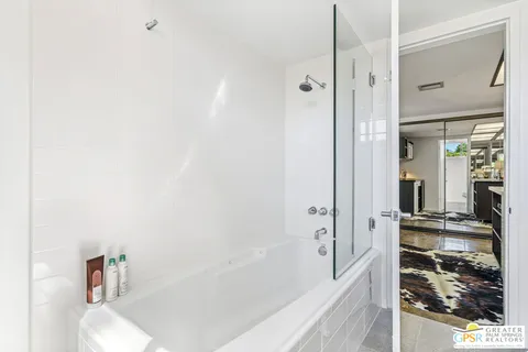 a view of a yard with palm trees