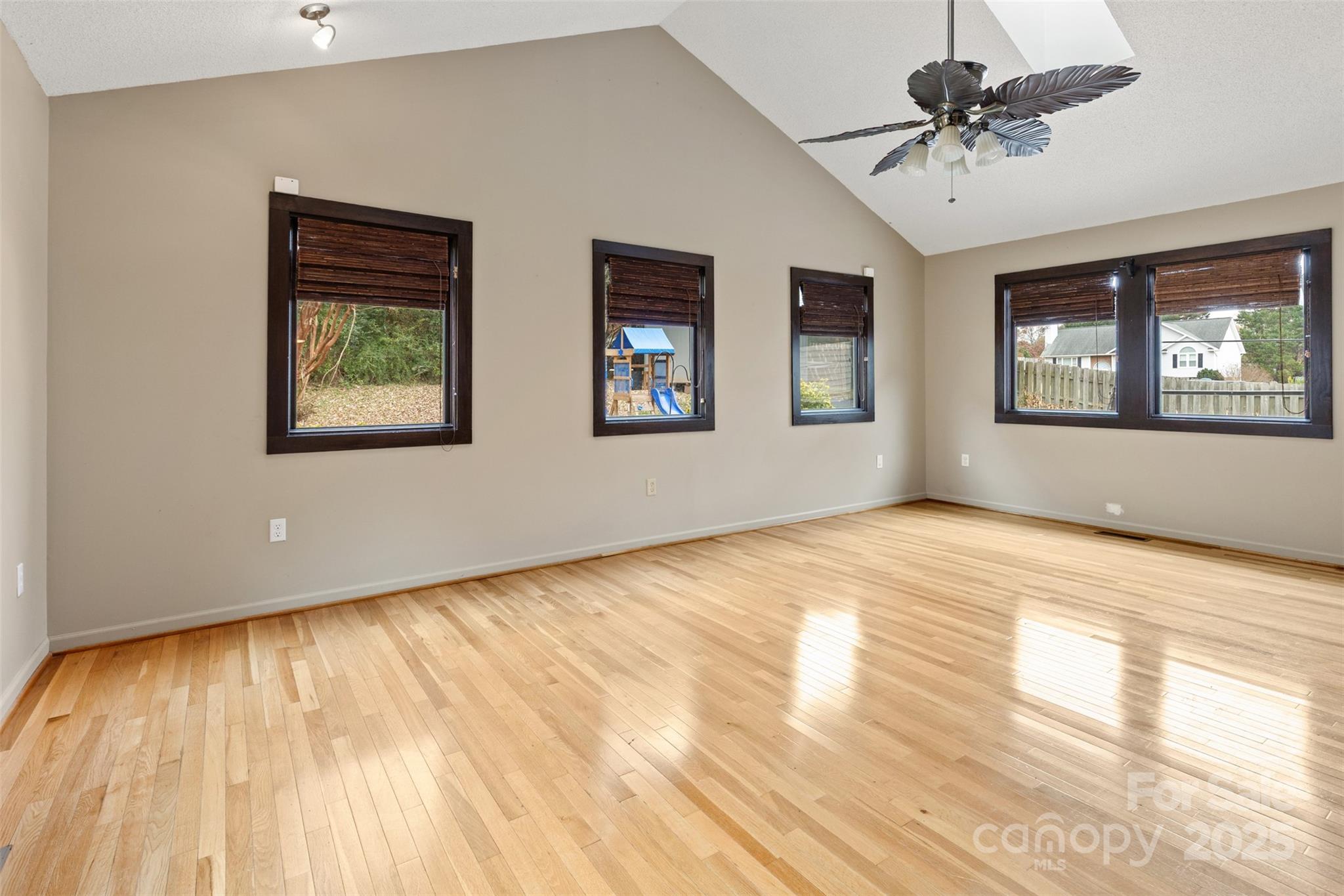 3233 6th Avenue Northeast Conover, NC 28613 - Photo 13 of 30 a view of an empty room with window and wooden floor