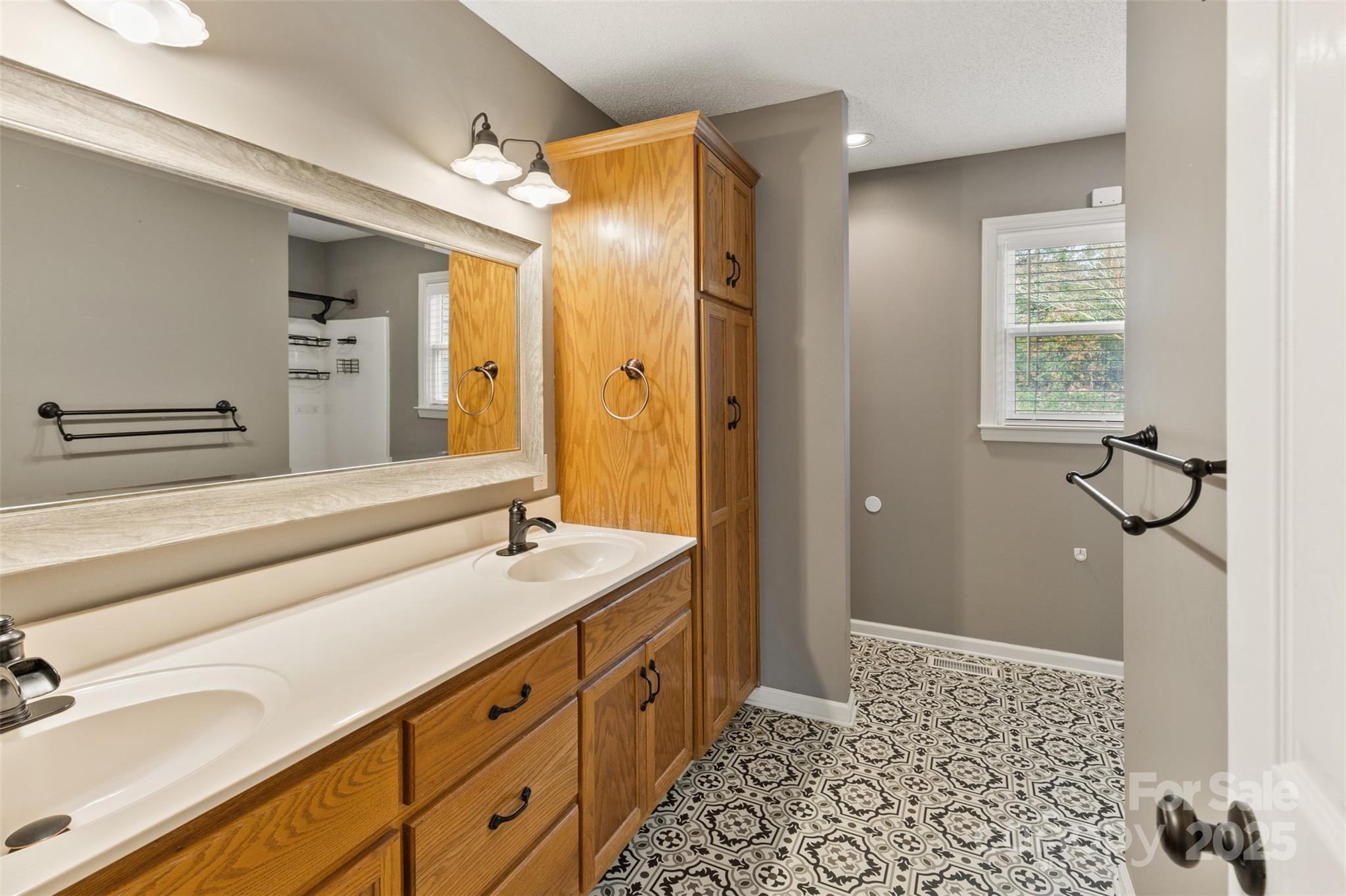 3233 6th Avenue Northeast Conover, NC 28613 - Photo 16 of 30 a spacious bathroom with a sink a mirror and a shower