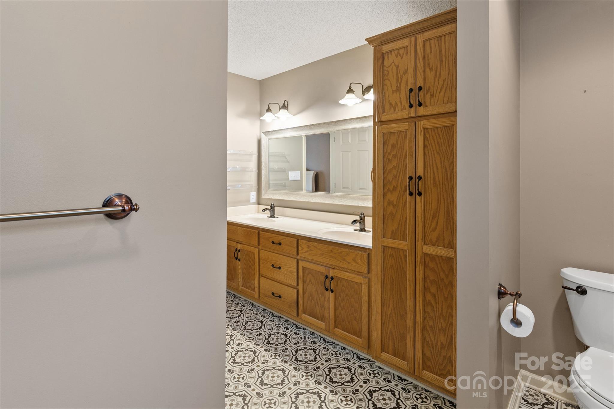 3233 6th Avenue Northeast Conover, NC 28613 - Photo 17 of 30 a bathroom with a sink and mirror with toilet