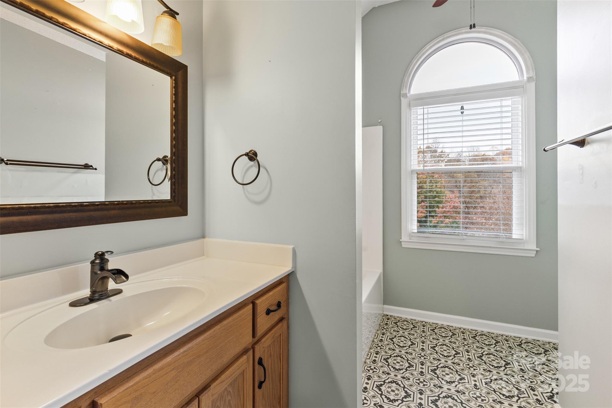 3233 6th Avenue Northeast Conover, NC 28613 - Photo 20 of 30 a bathroom with a sink a mirror and vanity