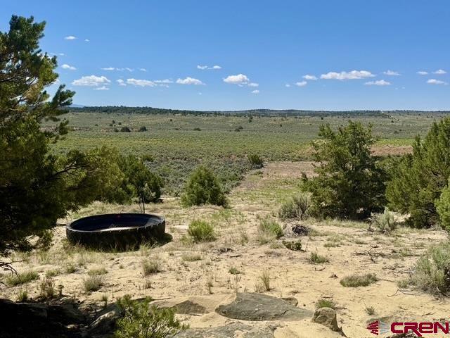 163 Cr 402 Road Lindrith, NM 87029 - Photo 13 of 16 a view of a lake with a swimming pool