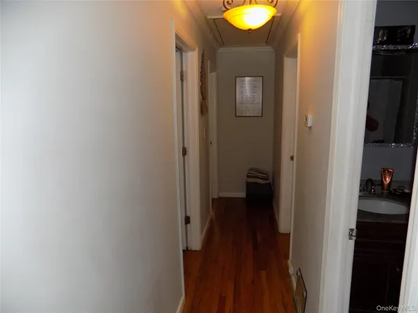 a view of a bathroom from a hallway