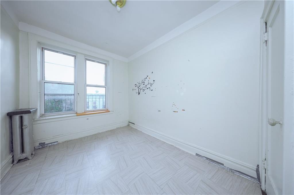729 59th Street Brooklyn, NY 11220 - Photo 25 of 36 an empty room with a window