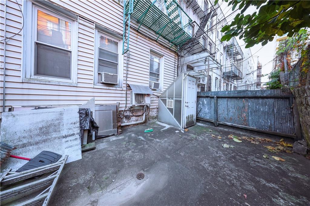 729 59th Street Brooklyn, NY 11220 - Photo 32 of 36 a view of a backyard with wooden fence