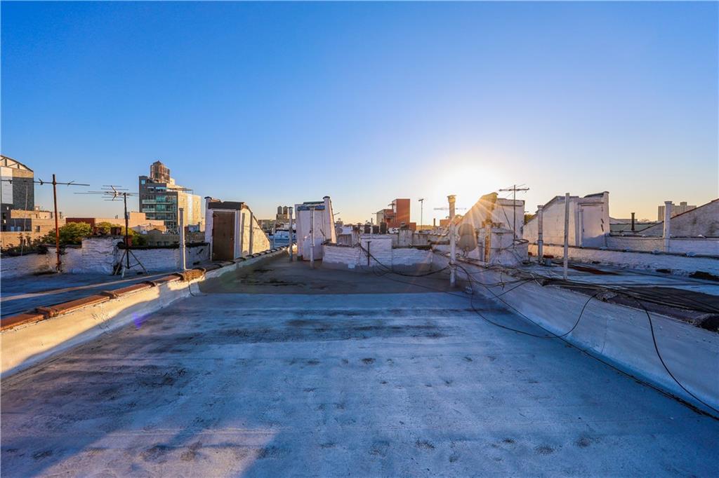 729 59th Street Brooklyn, NY 11220 - Photo 34 of 36 a view of a city with tall buildings and ocean view