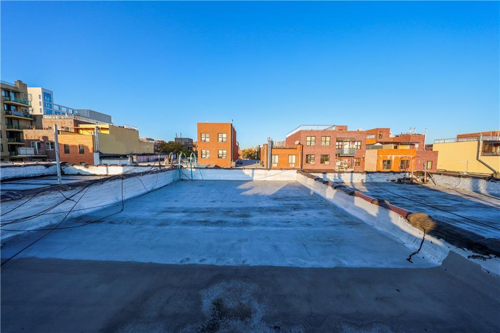 729 59th Street Brooklyn, NY 11220 - Photo 35 of 36 a view of a living room with furniture
