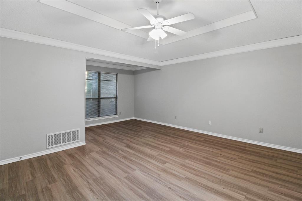 4017 St Christopher Lane Dallas, TX 75287 - Photo 11 of 16 wooden floor in an empty room with a window