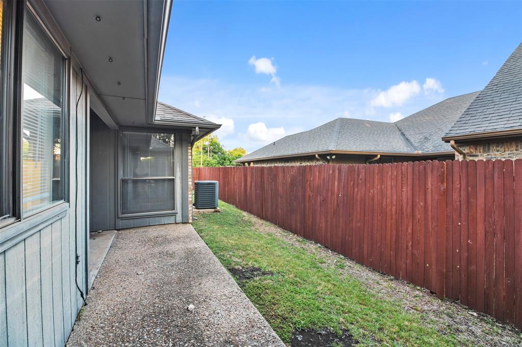 4017 St Christopher Lane Dallas, TX 75287 - Photo 15 of 16 a view of a house with backyard and wooden fence