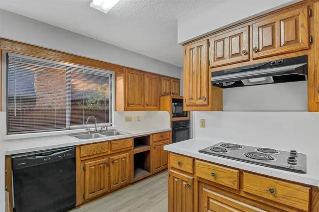 a kitchen with stainless steel appliances granite countertop a stove and a sink