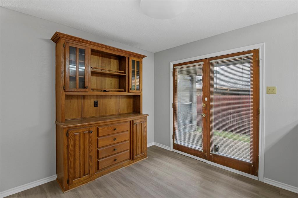 4017 St Christopher Lane Dallas, TX 75287 - Photo 6 of 16 a view of an empty room with wooden floor and a window