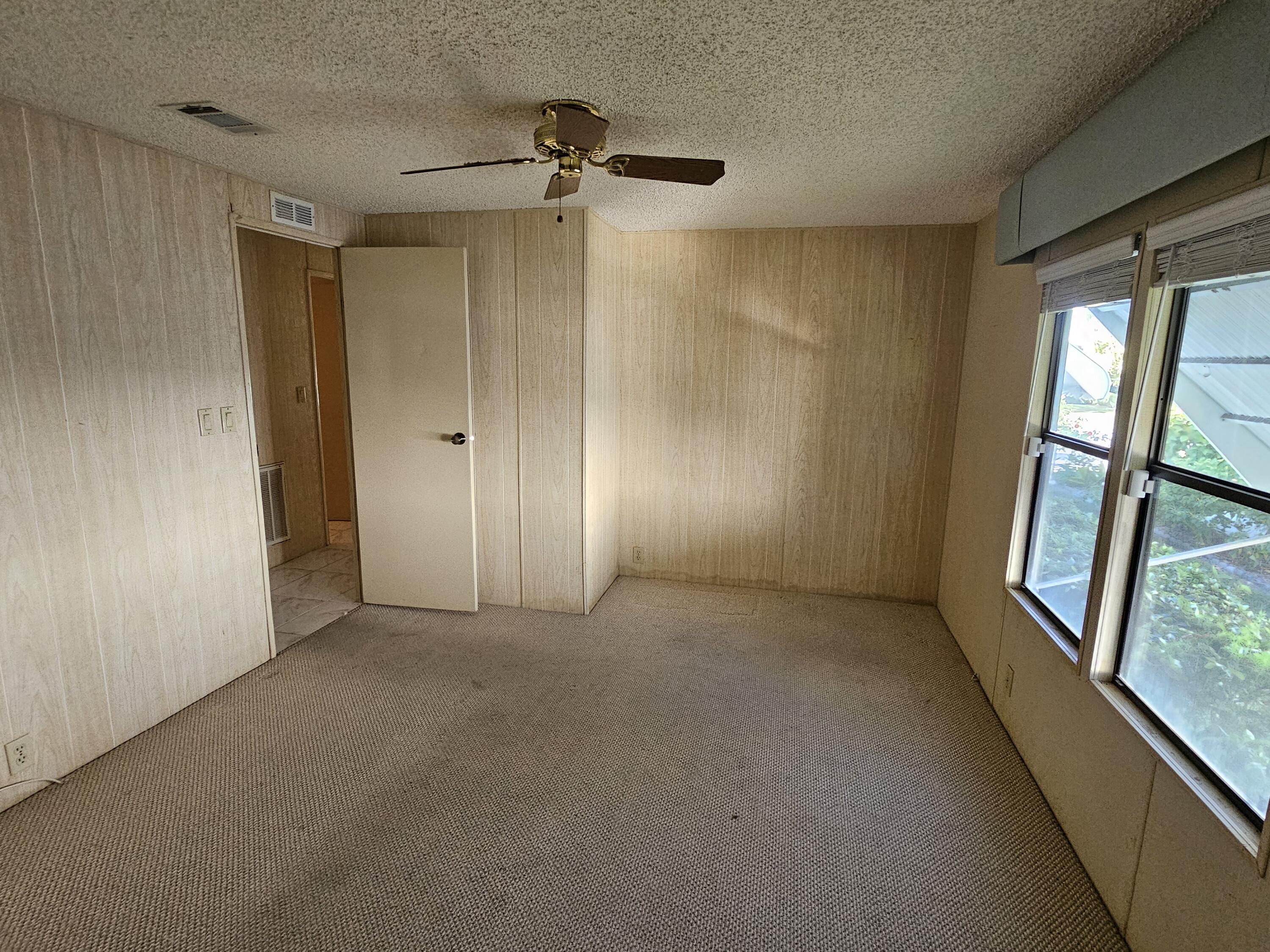 6978 Southeast Delegate Street Hobe Sound, FL 33455 - Photo 23 of 24 a view of empty room with windows