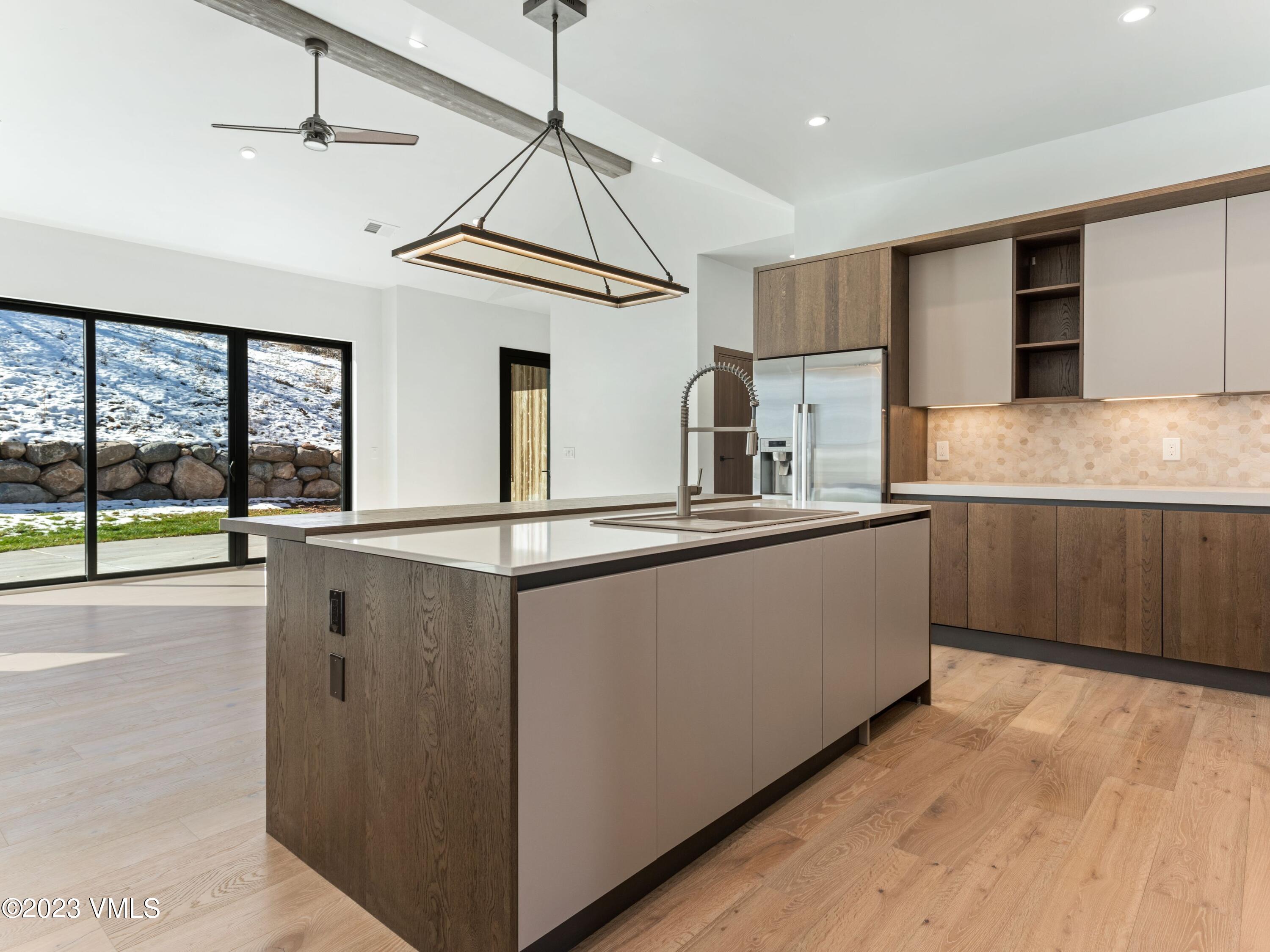 2494 Eagle Ranch Road Eagle, CO 81631 - Photo 14 of 49 a kitchen with stainless steel appliances granite countertop a stove a sink and a refrigerator