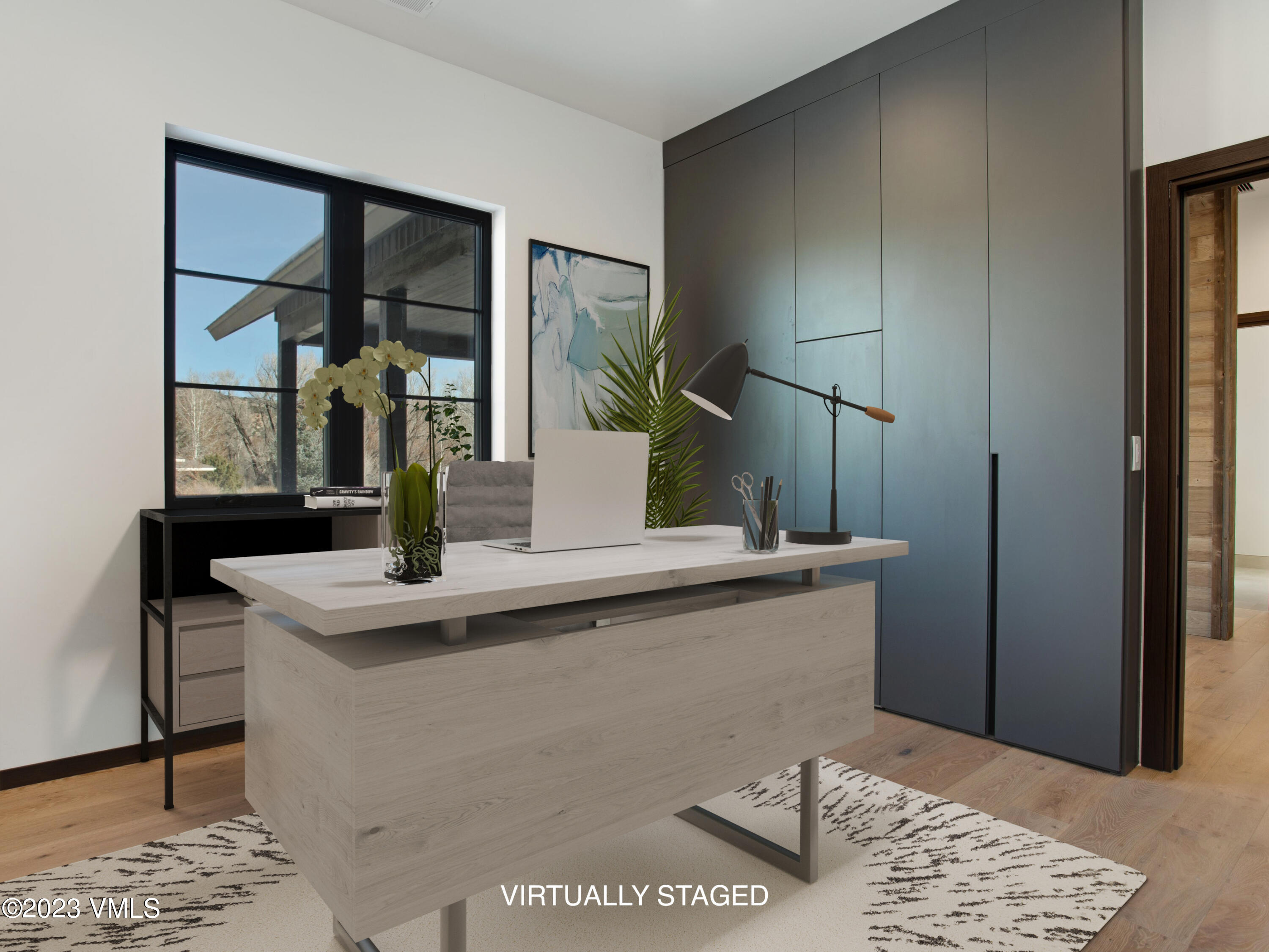 2494 Eagle Ranch Road Eagle, CO 81631 - Photo 16 of 49 a view of kitchen island with furniture and wooden floor