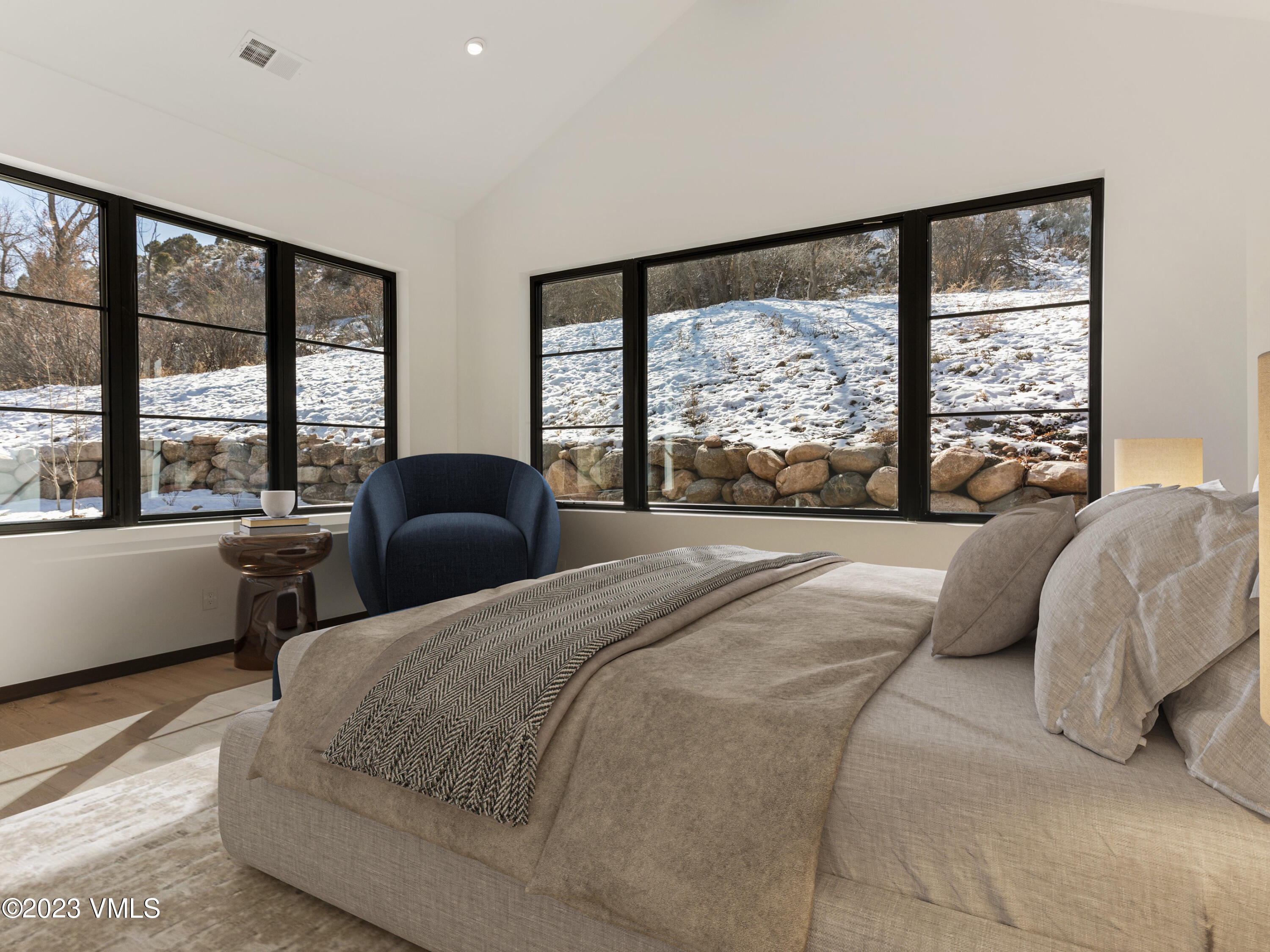 2494 Eagle Ranch Road Eagle, CO 81631 - Photo 20 of 49 a bedroom with a large bed and a large window