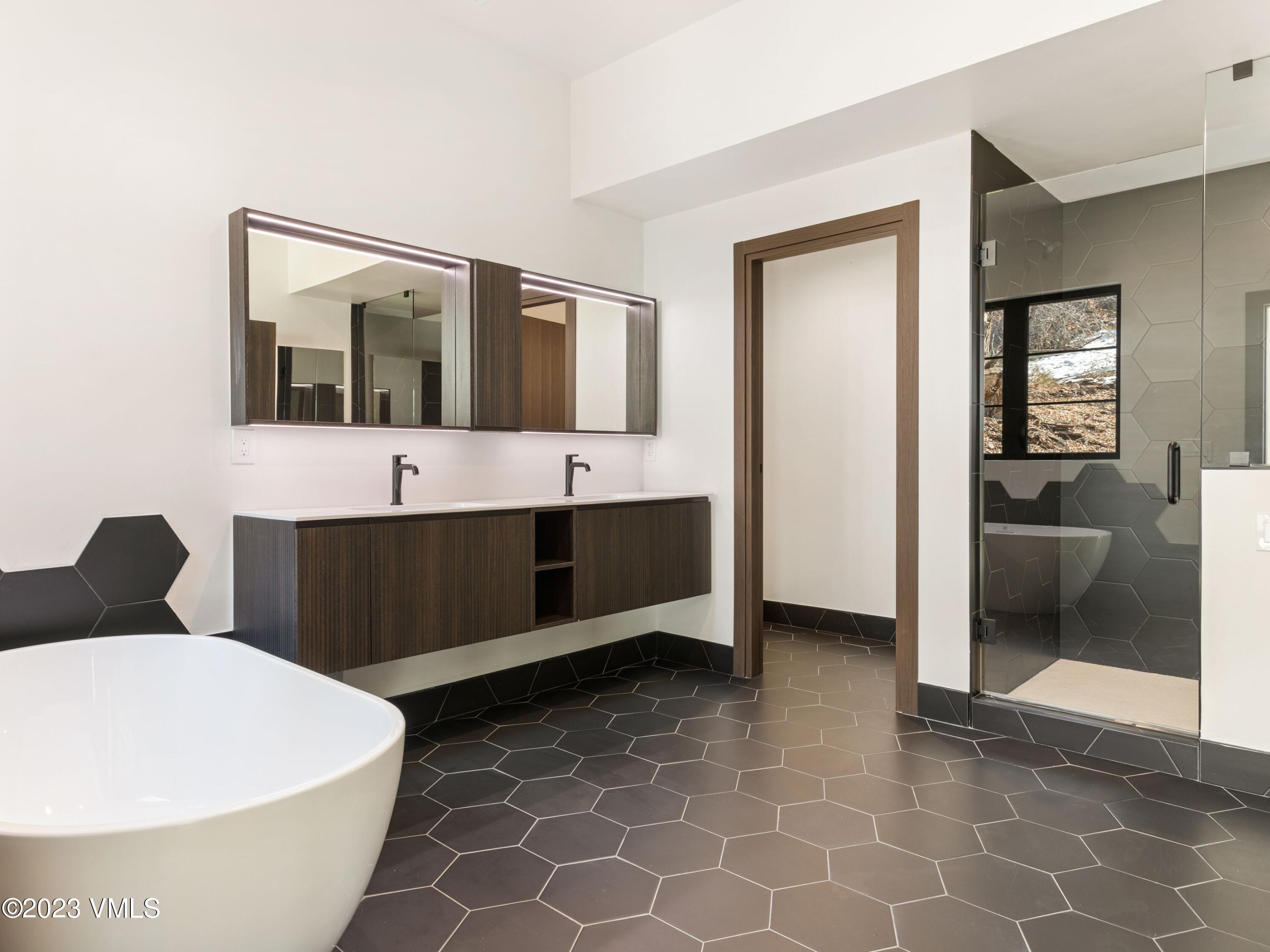 2494 Eagle Ranch Road Eagle, CO 81631 - Photo 22 of 49 a bathroom with a bathtub and a sink