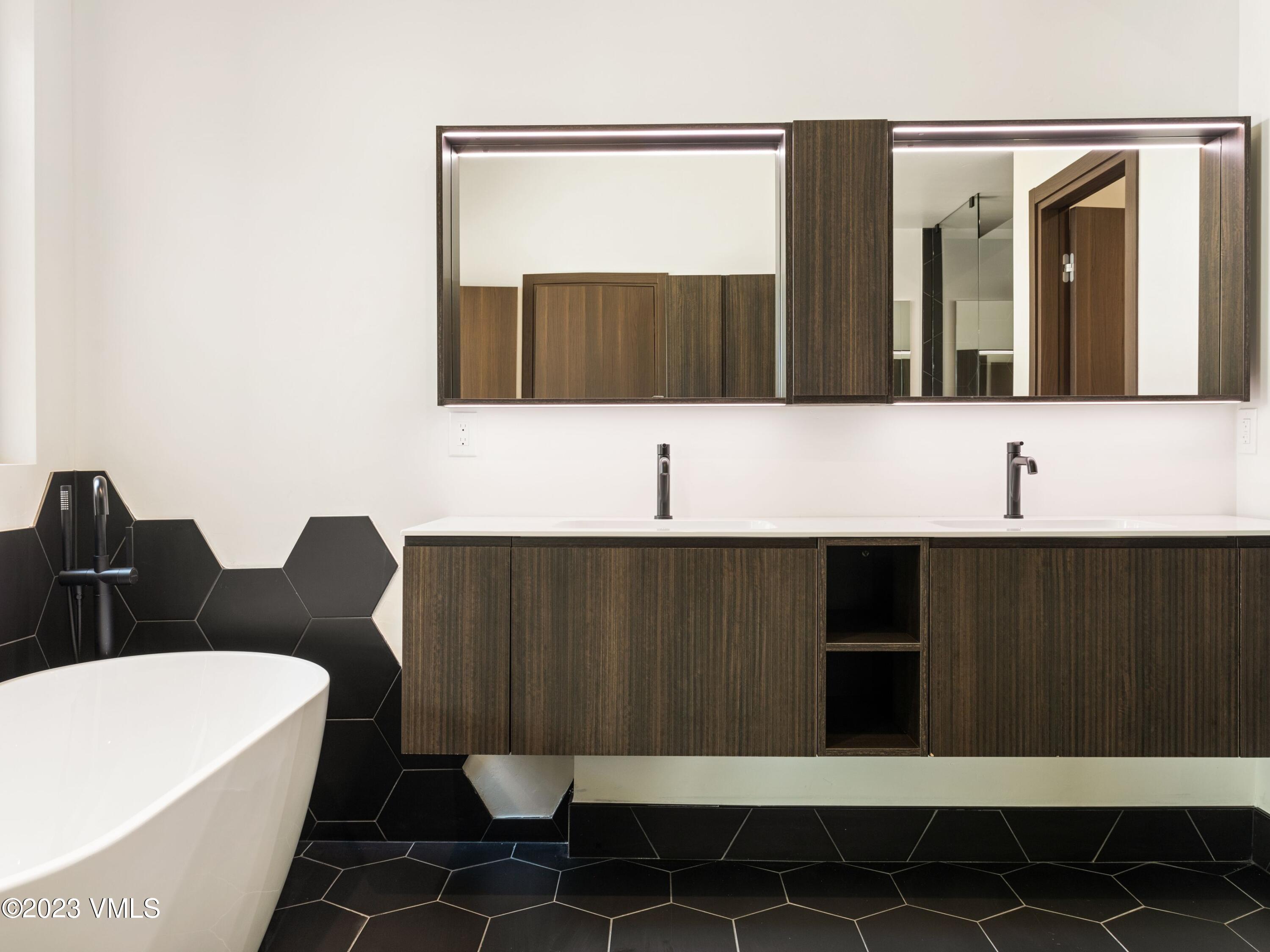 2494 Eagle Ranch Road Eagle, CO 81631 - Photo 23 of 49 a bathroom with a sink and a mirror