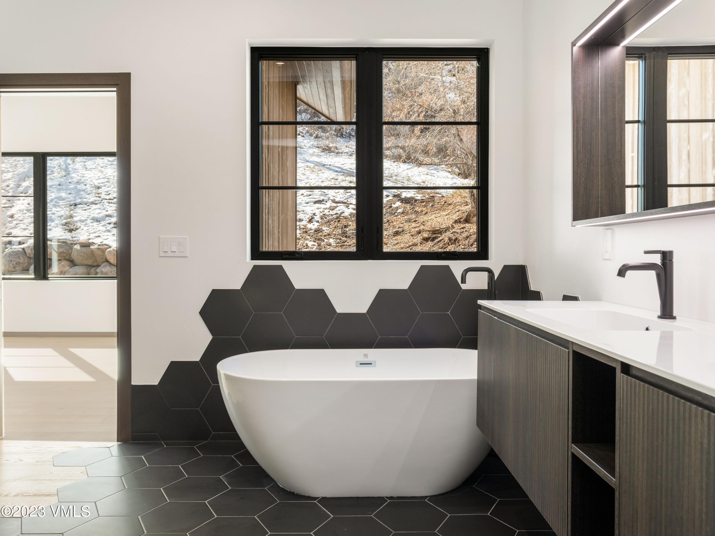2494 Eagle Ranch Road Eagle, CO 81631 - Photo 24 of 49 a white bath tub sitting next to a window
