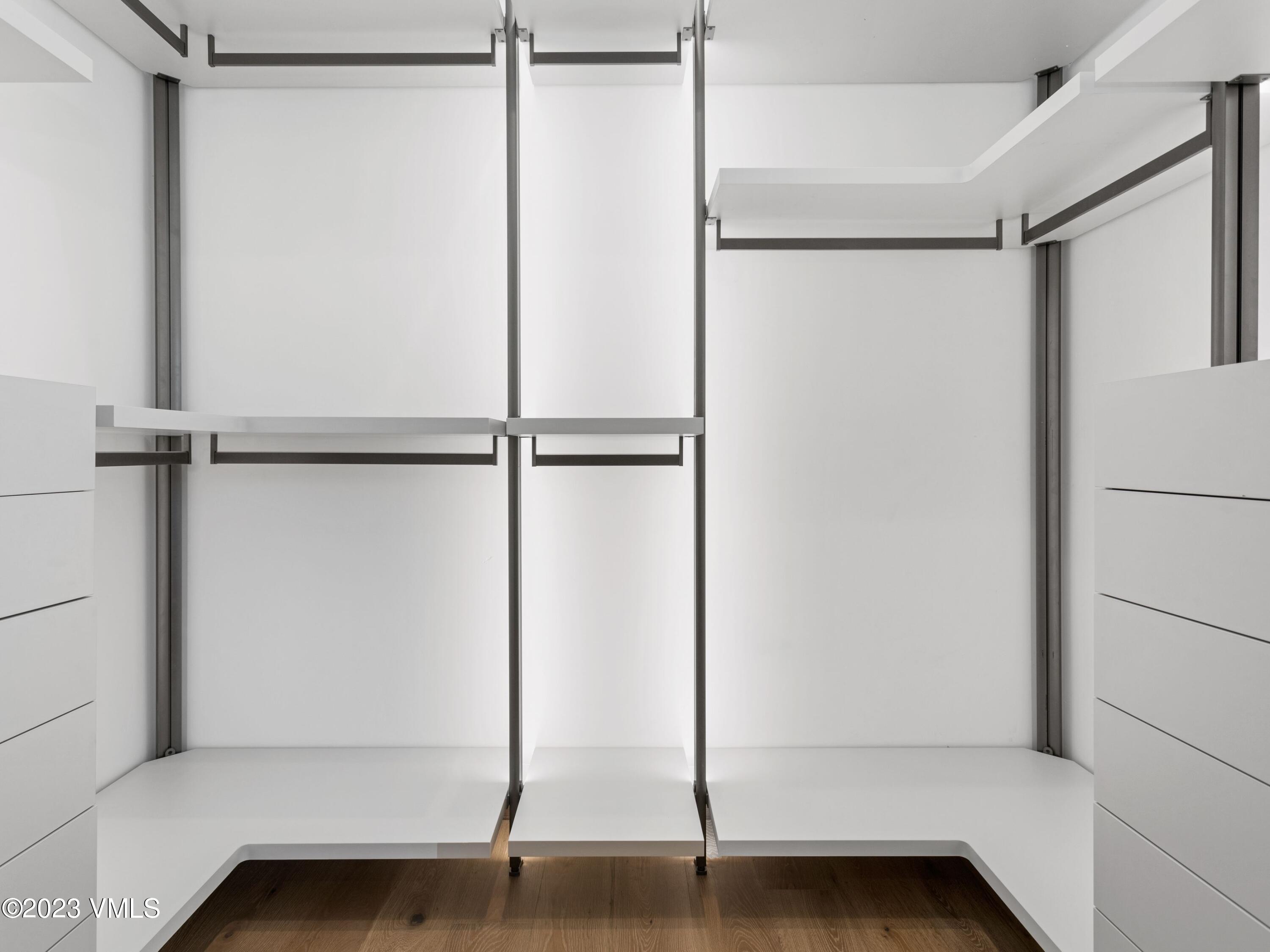 2494 Eagle Ranch Road Eagle, CO 81631 - Photo 25 of 49 a view of an empty room with wooden floor and a window