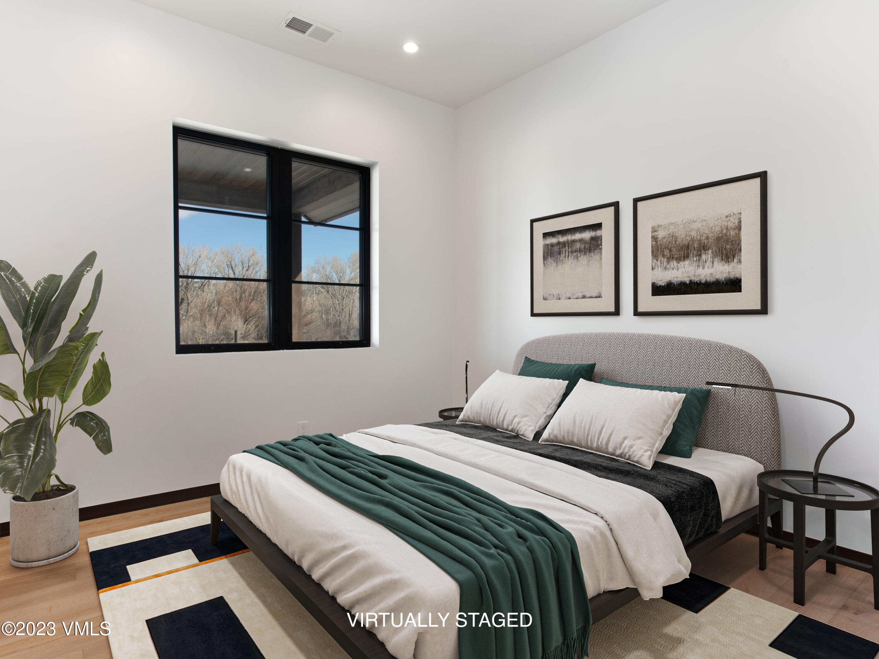 2494 Eagle Ranch Road Eagle, CO 81631 - Photo 29 of 49 a bedroom with a bed and a painting on the wall