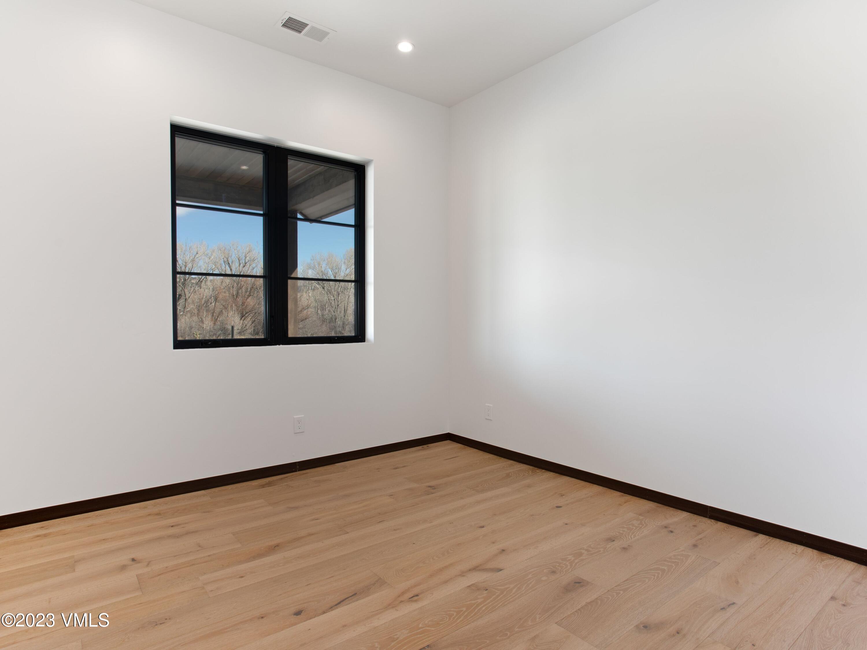 2494 Eagle Ranch Road Eagle, CO 81631 - Photo 30 of 49 an empty room with a window