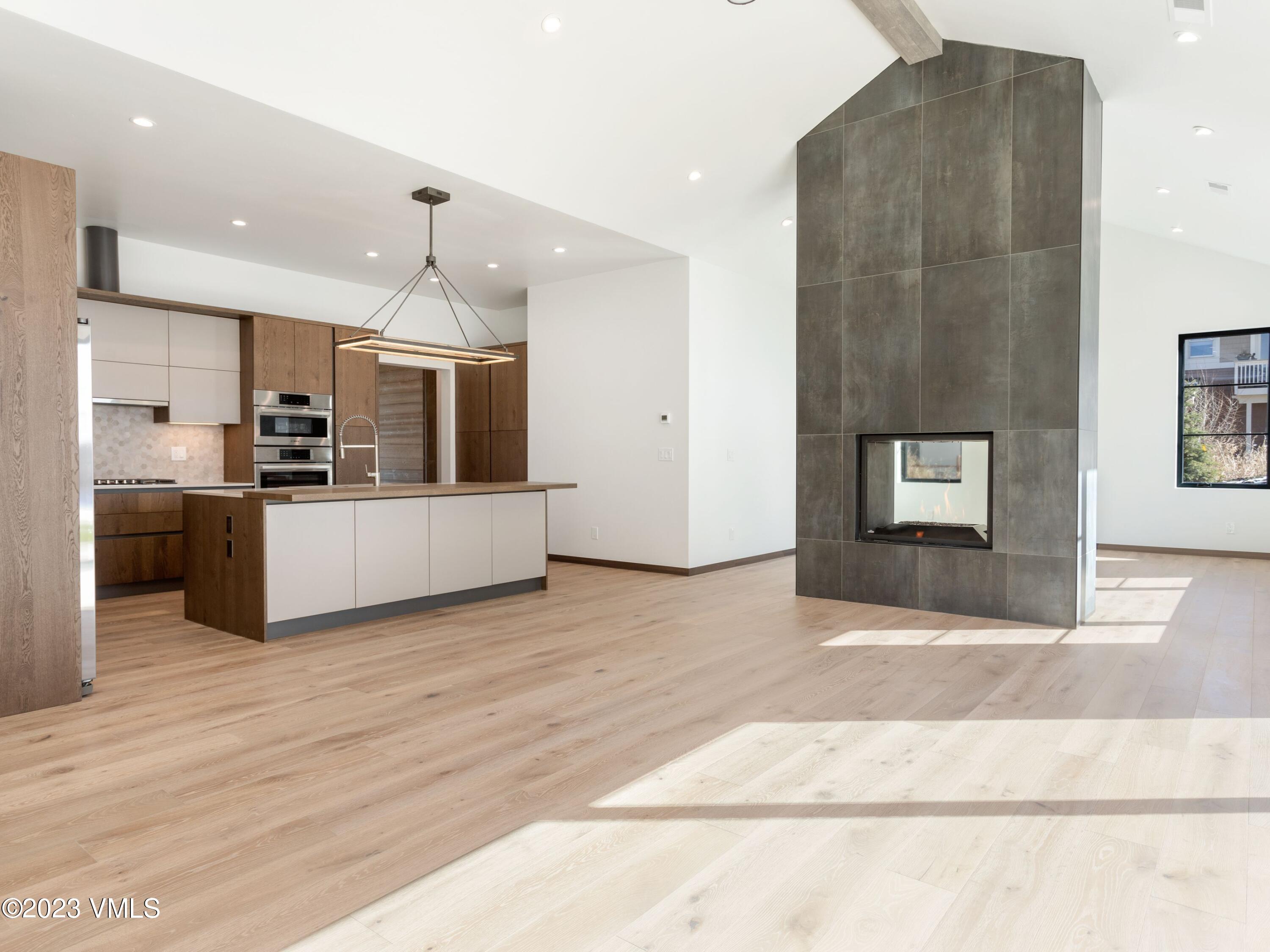 2494 Eagle Ranch Road Eagle, CO 81631 - Photo 3 of 49 a view of a kitchen with a sink and a refrigerator