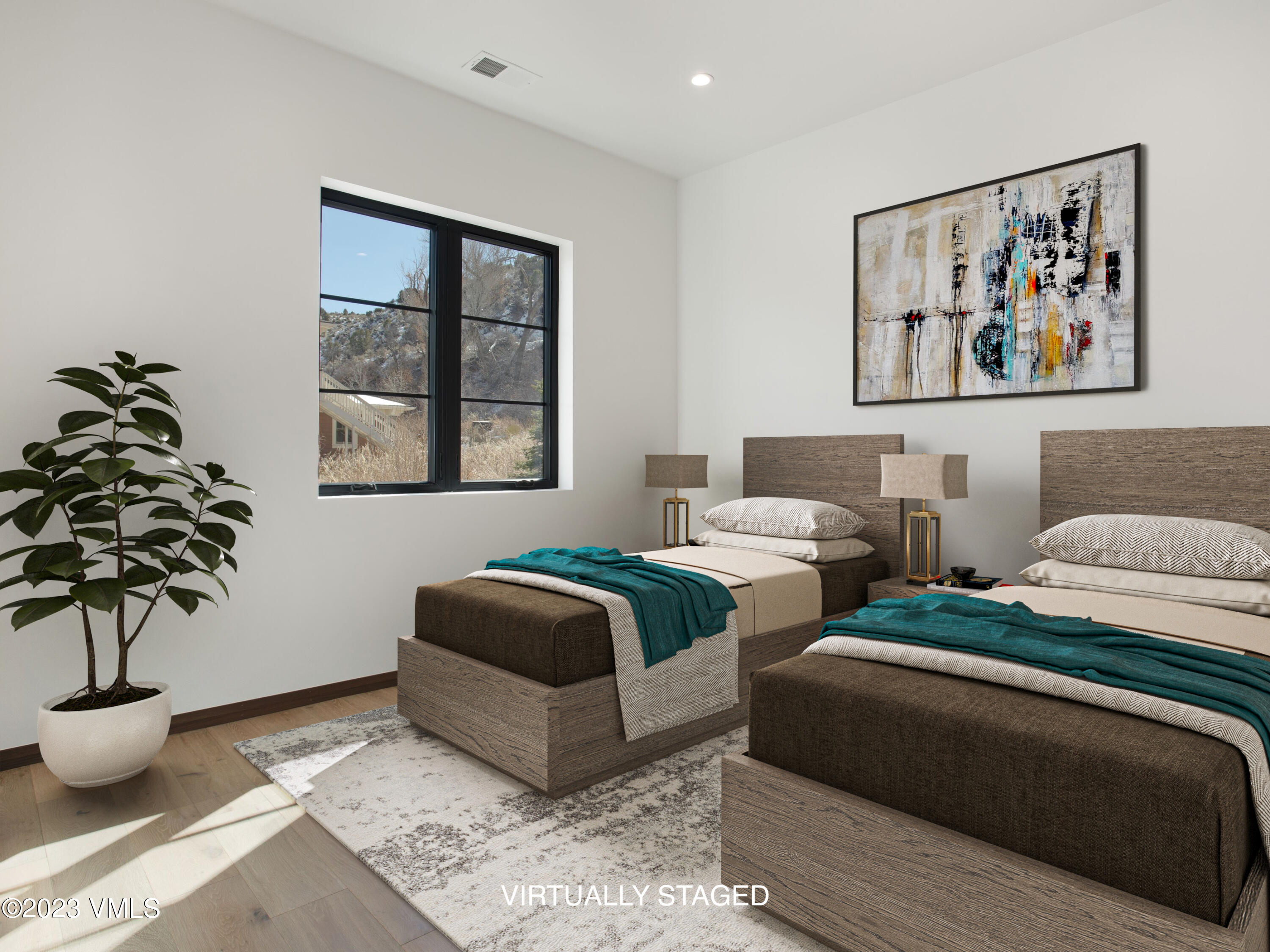 2494 Eagle Ranch Road Eagle, CO 81631 - Photo 31 of 49 a spacious bedroom with two beds and a potted plant