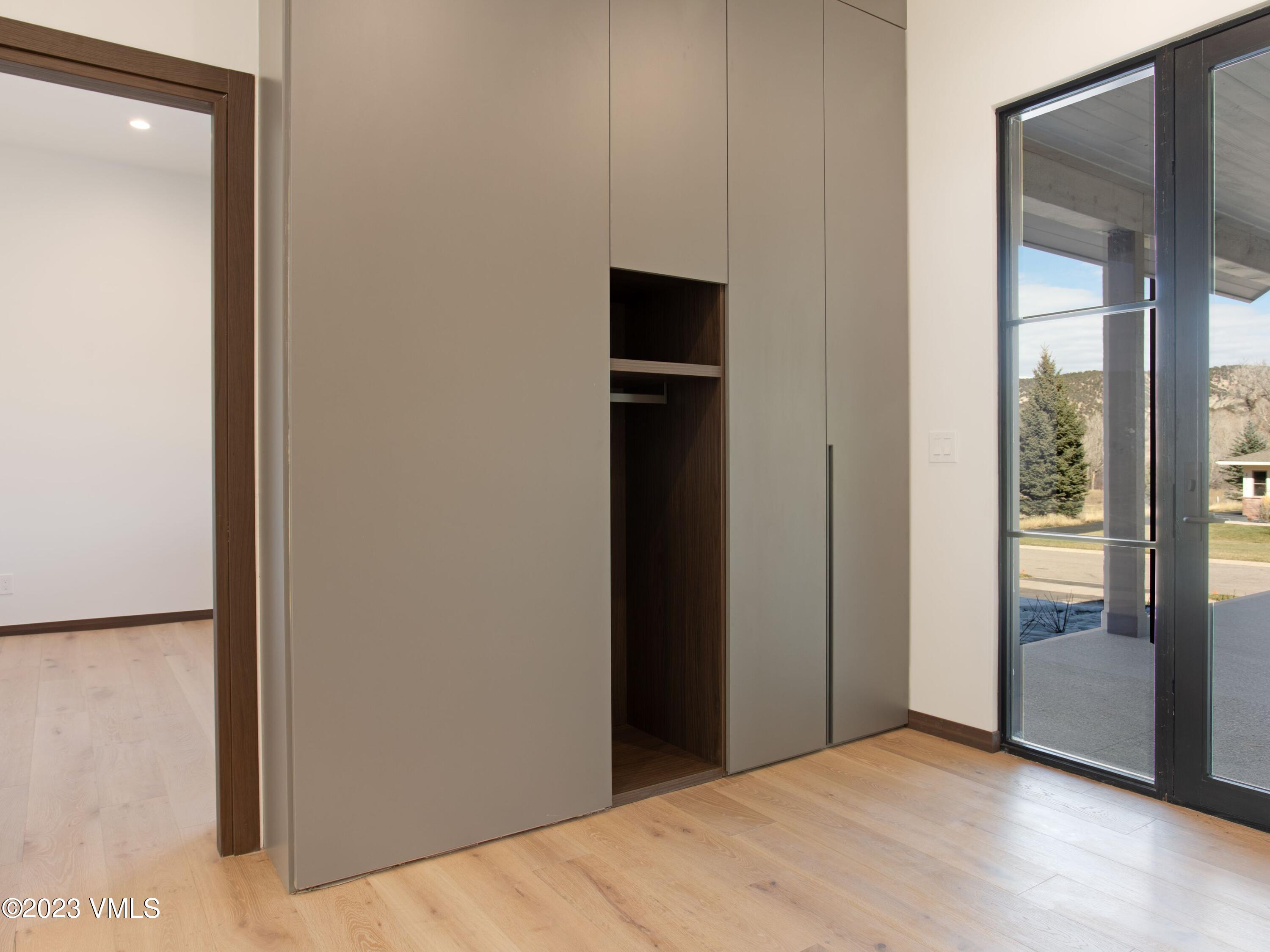 2494 Eagle Ranch Road Eagle, CO 81631 - Photo 35 of 49 a view of an empty room with a glass door
