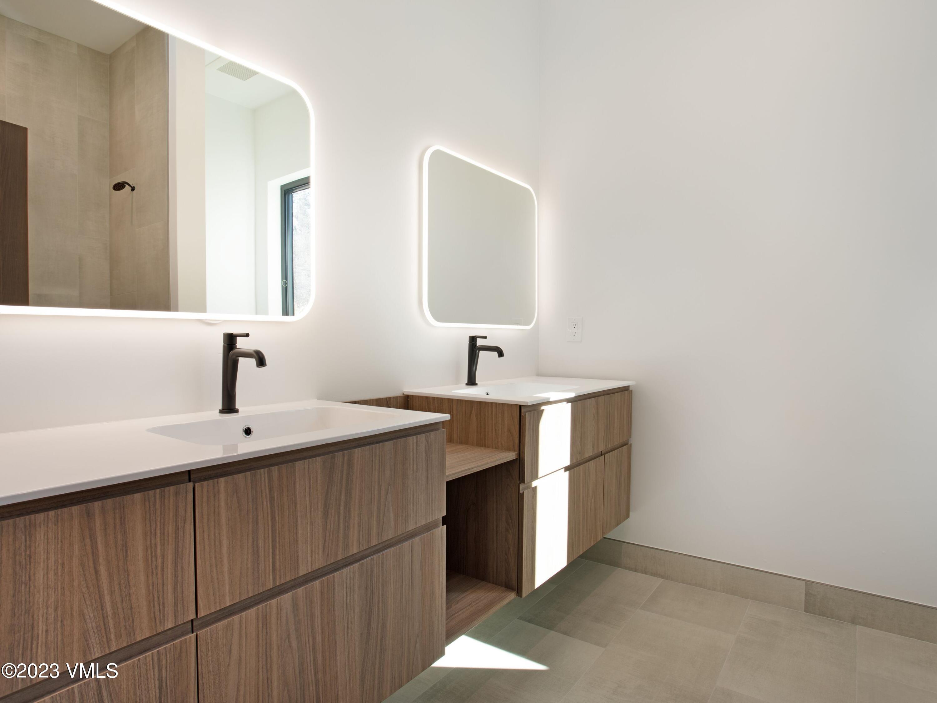2494 Eagle Ranch Road Eagle, CO 81631 - Photo 39 of 49 a kitchen with a sink and a mirror