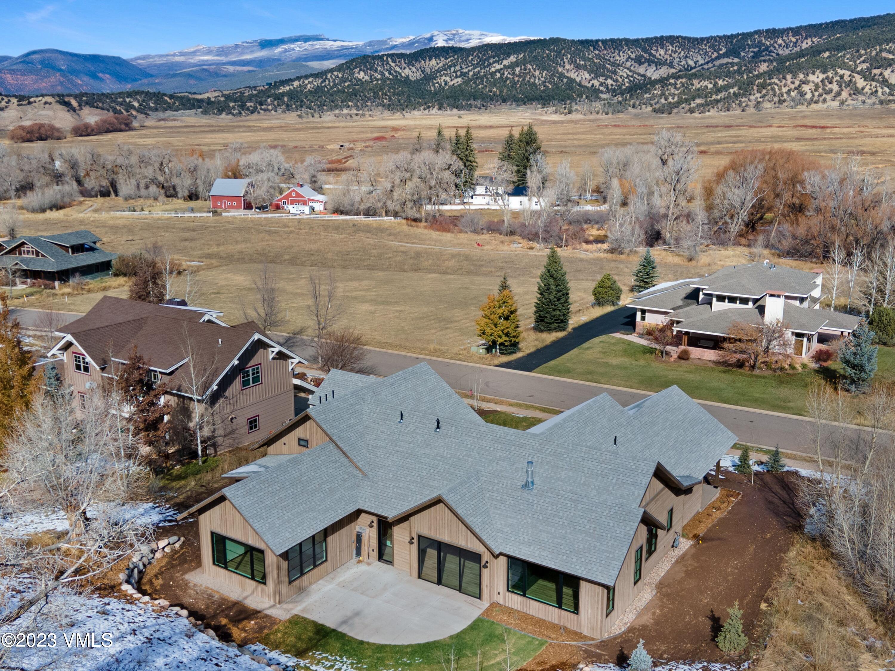 2494 Eagle Ranch Road Eagle, CO 81631 - Photo 47 of 49 an aerial view of a house with a lake view