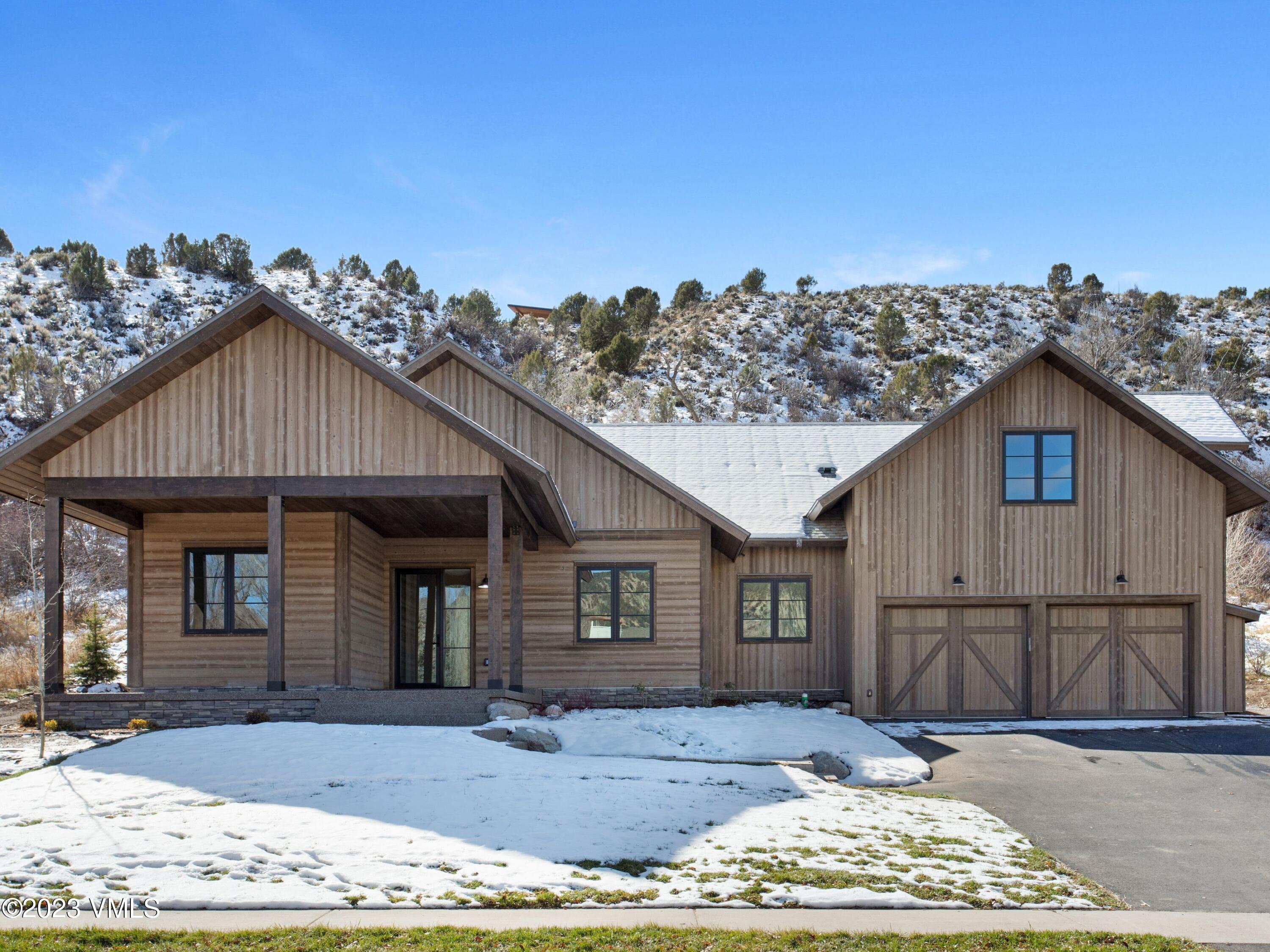2494 Eagle Ranch Road Eagle, CO 81631 - Photo 48 of 49 a view of a yard in front of a house with wooden fence