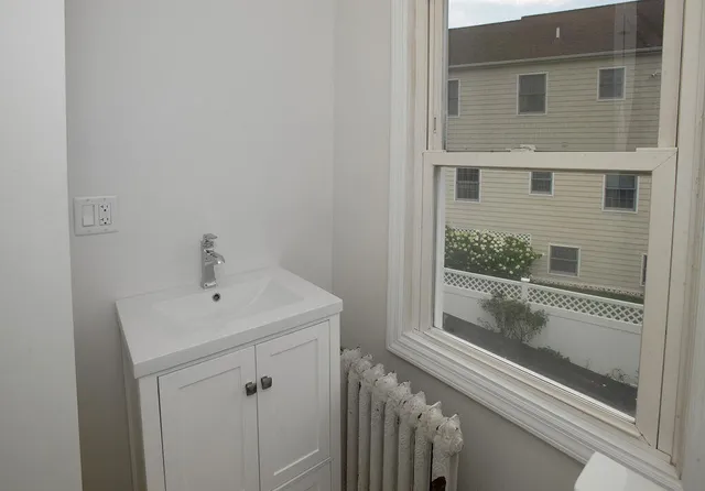 a bathroom with a toilet and a sink