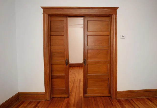 a view of walk in closet with empty room
