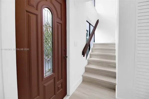 a view of entryway with wooden floor
