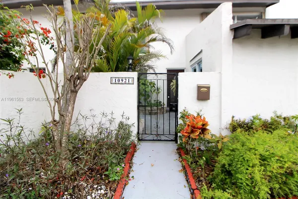 a view of a potted plant in front of a building